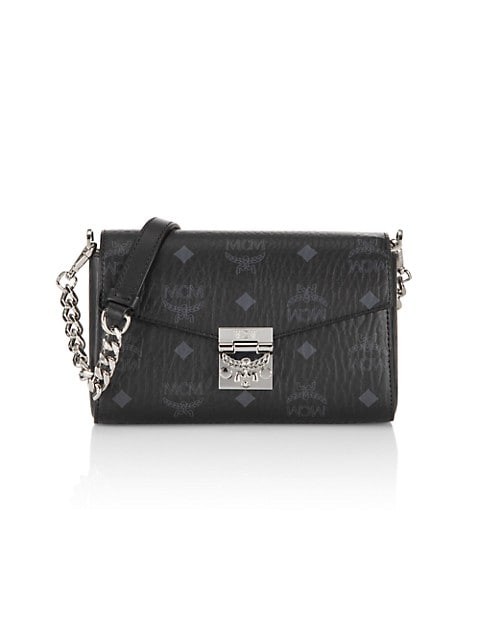 MCM's signature logo print adorns this clutch, which can also be worn across the body.; Top flap wit