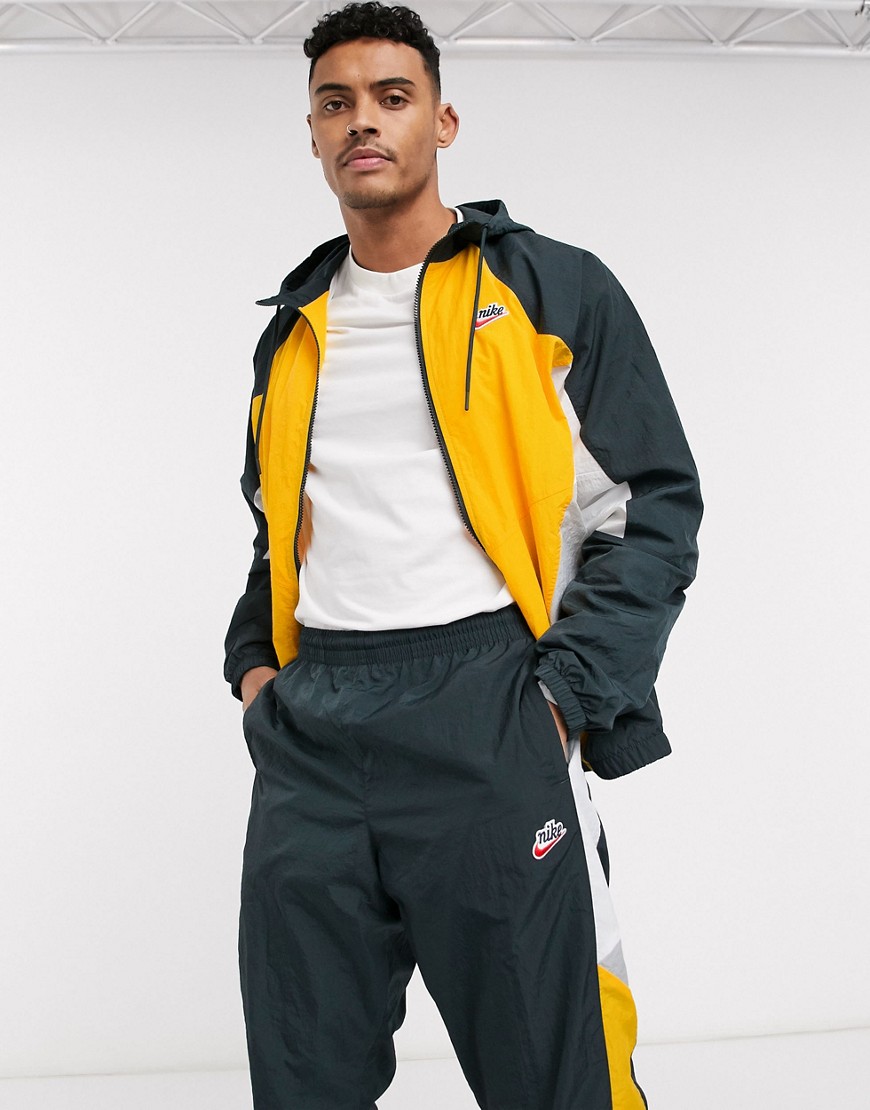 Track jacket by Nike Coming soon to your Saved Items Colour-block design Drawstring hood Zip fasteni