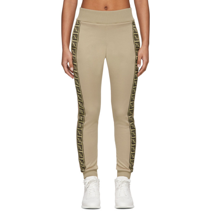 Slim-fit cotton-blend jersey lounge pants in beige. Mid-rise. Two-pocket styling. Rib knit elasticiz