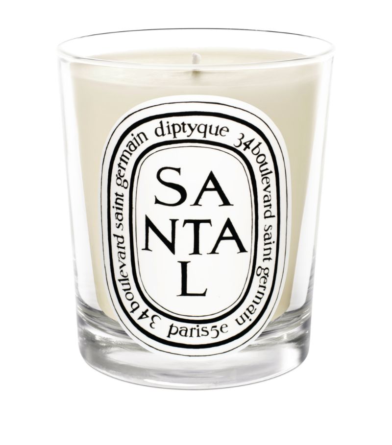 Drawing on the warming, welcome scent of woody shavings and fine sawdust, the Santal candle from Dip