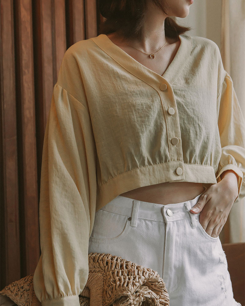 落肩設計/V領 商品長度/短版商品版型/寬鬆商品厚薄/適中商品彈性/無