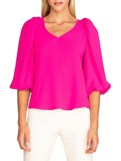 Cropped puff sleeves lend a bold silhouette to this blouse.; V-neck; Elbow-length puff sleeves; Pull