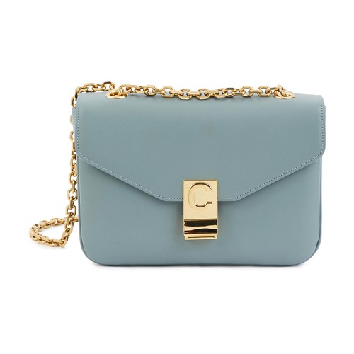 This Medium C bag in calfskin is by Celine. This piece's sliding chain enables you to wear it on the