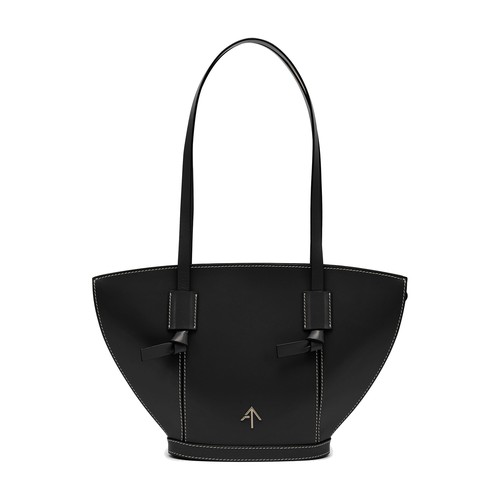 With smooth ebony-colored leather and immaculate stitching, the Mulan bag by Manu Atelier offers inc