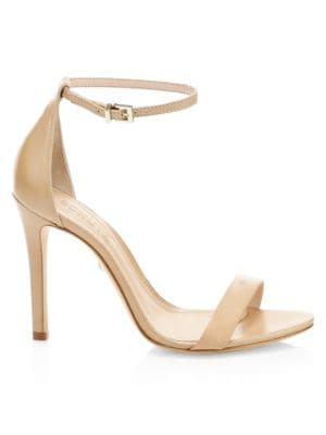 Sleek ankle-strap pumps finished in smooth leather.; Leather upper; Adjustable buckled ankle strap; 