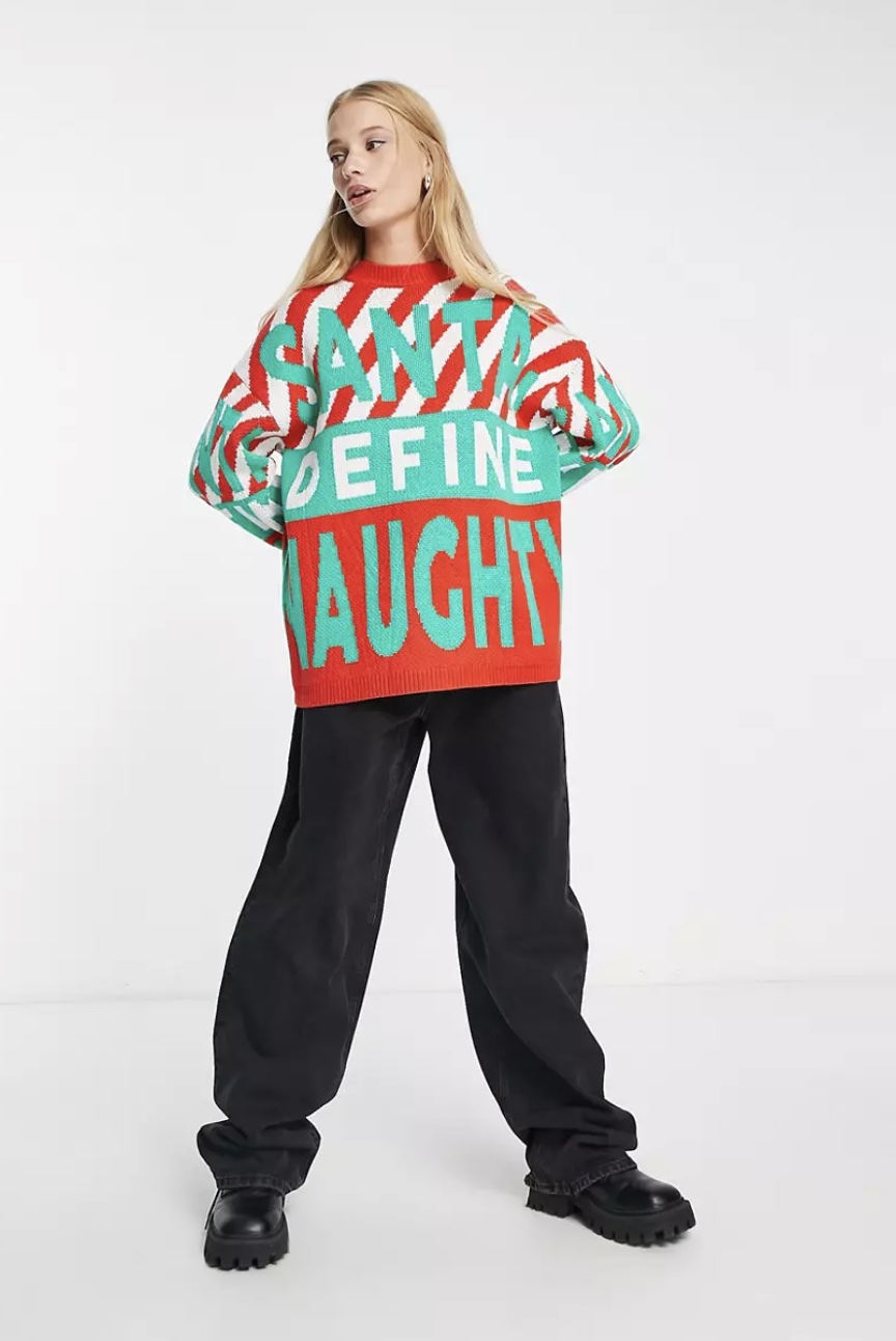 ASOS DESIGN Christmas jumper with Santa define naughty pattern