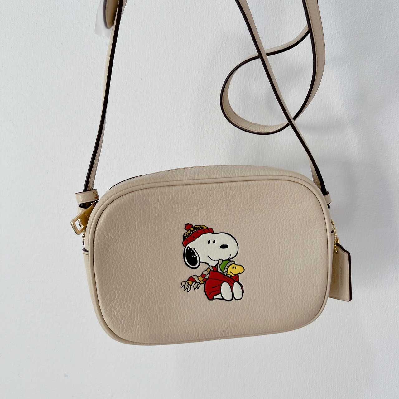 Coach CF249 Coach X Peanuts Mini Jamie Camera Bag With Snoopy In Gold/Ivory  Multi 